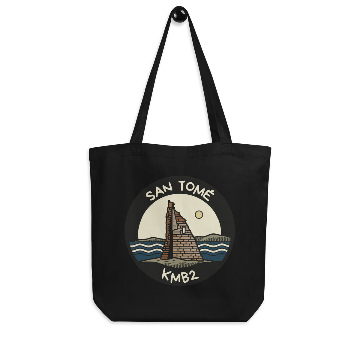 Tote bag negra San Tomé Black Edition, vista frontal con ilustración de la torre y el mar