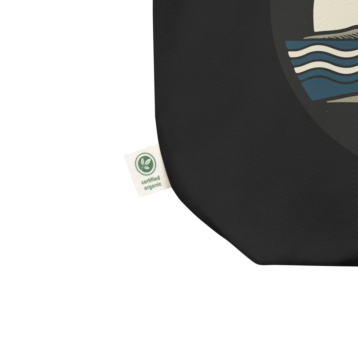 Detalle del tejido y estampado de la tote bag negra San Tomé de KMB2